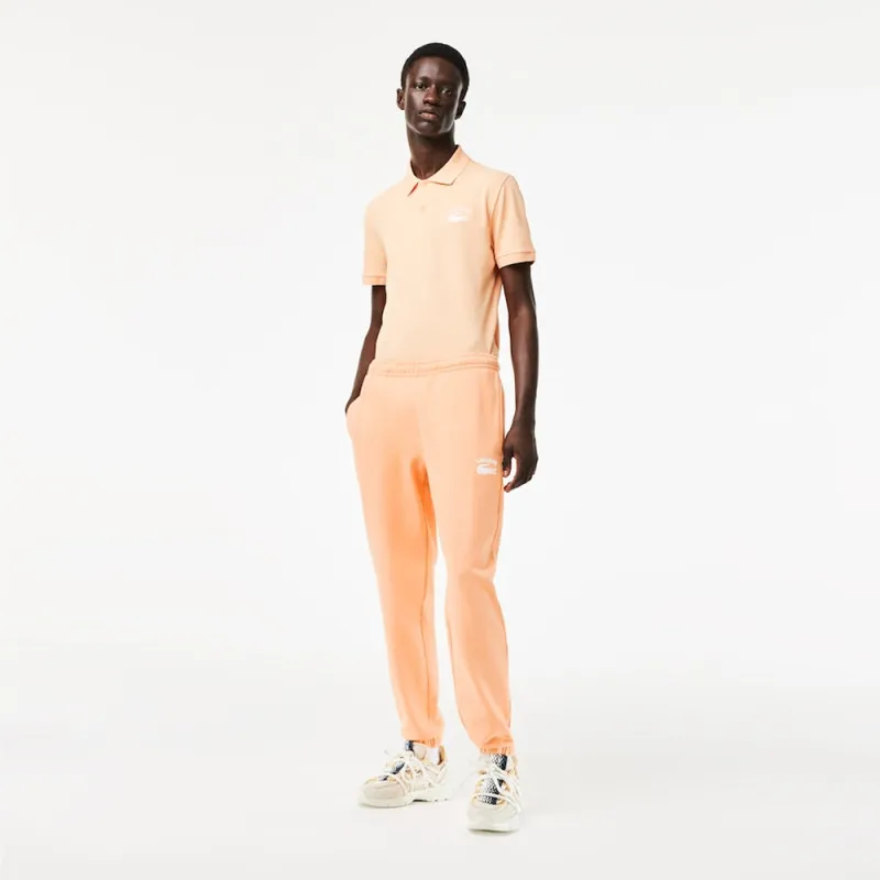 PANTALON DE SURVÊTEMENT HOMME COUPE FUSELÉE INSCRPITION LACOSTE ORANGE