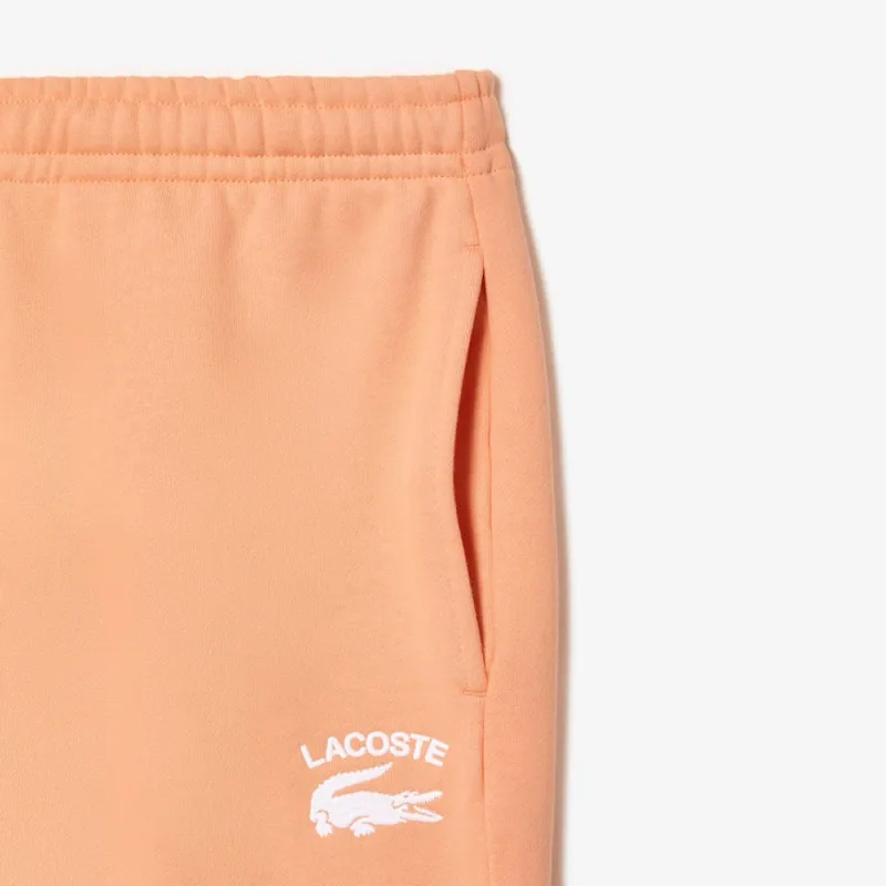 PANTALON DE SURVÊTEMENT HOMME COUPE FUSELÉE INSCRPITION LACOSTE ORANGE