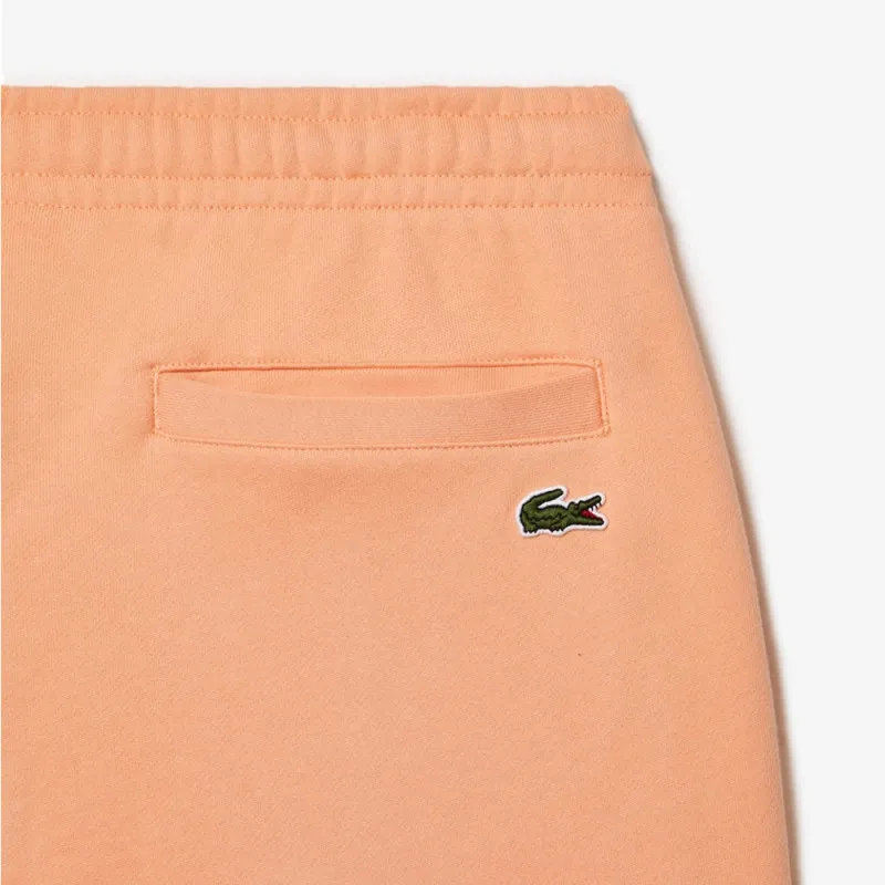 PANTALON DE SURVÊTEMENT HOMME COUPE FUSELÉE INSCRPITION LACOSTE ORANGE