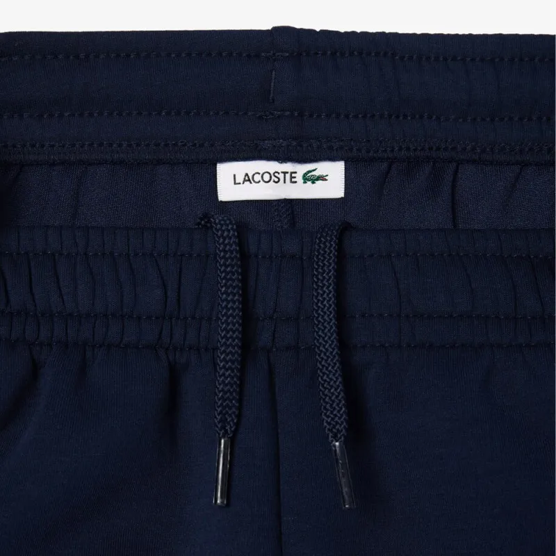 PANTALON DE SURVÊTEMENT LACOSTE ENFANT BLEU MARINE AVEC FINITIONS CONTRASTÉES